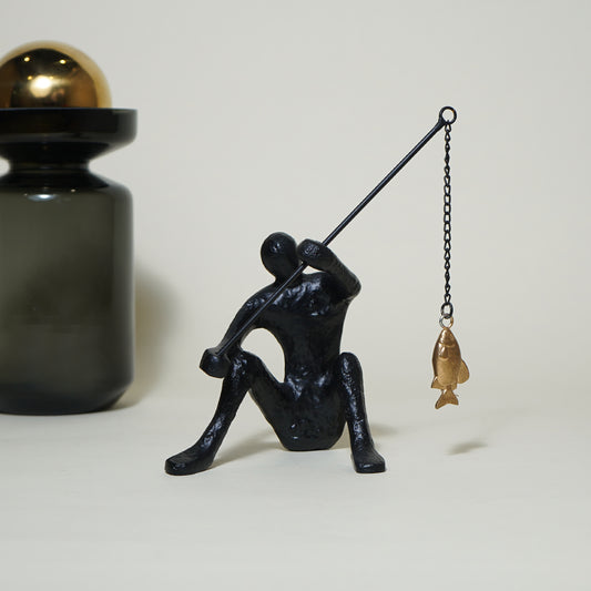Dux Fishing Man Sculpture