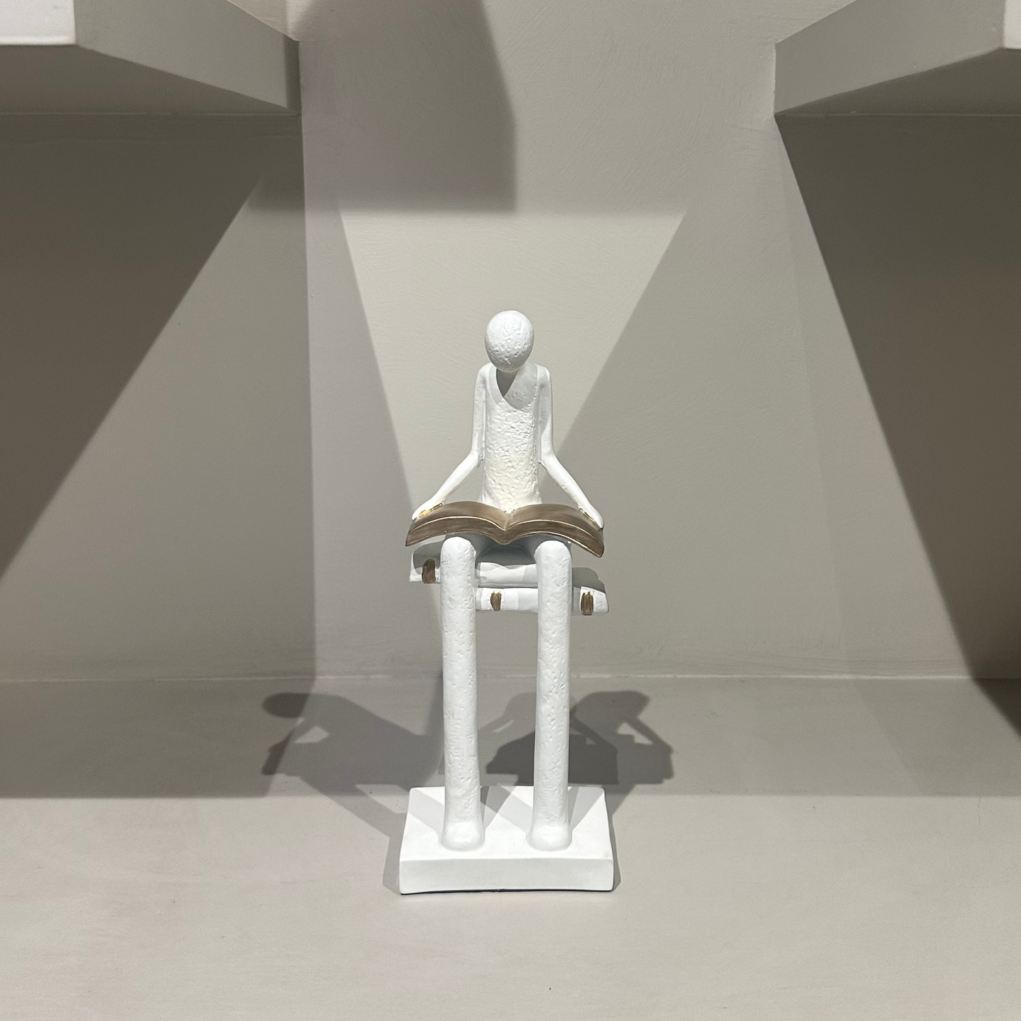 Liber White Reading Man Sculpture