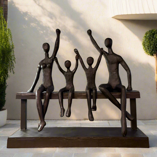 La Familia large outdoor sculpture displayed in a modern garden setting