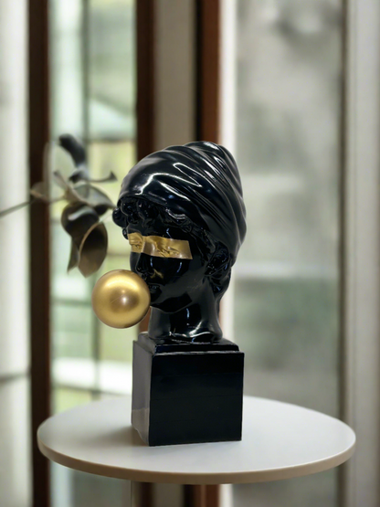 Black and gold Roman Lady Sculpture placed on a pedestal – luxury ceramic home decor