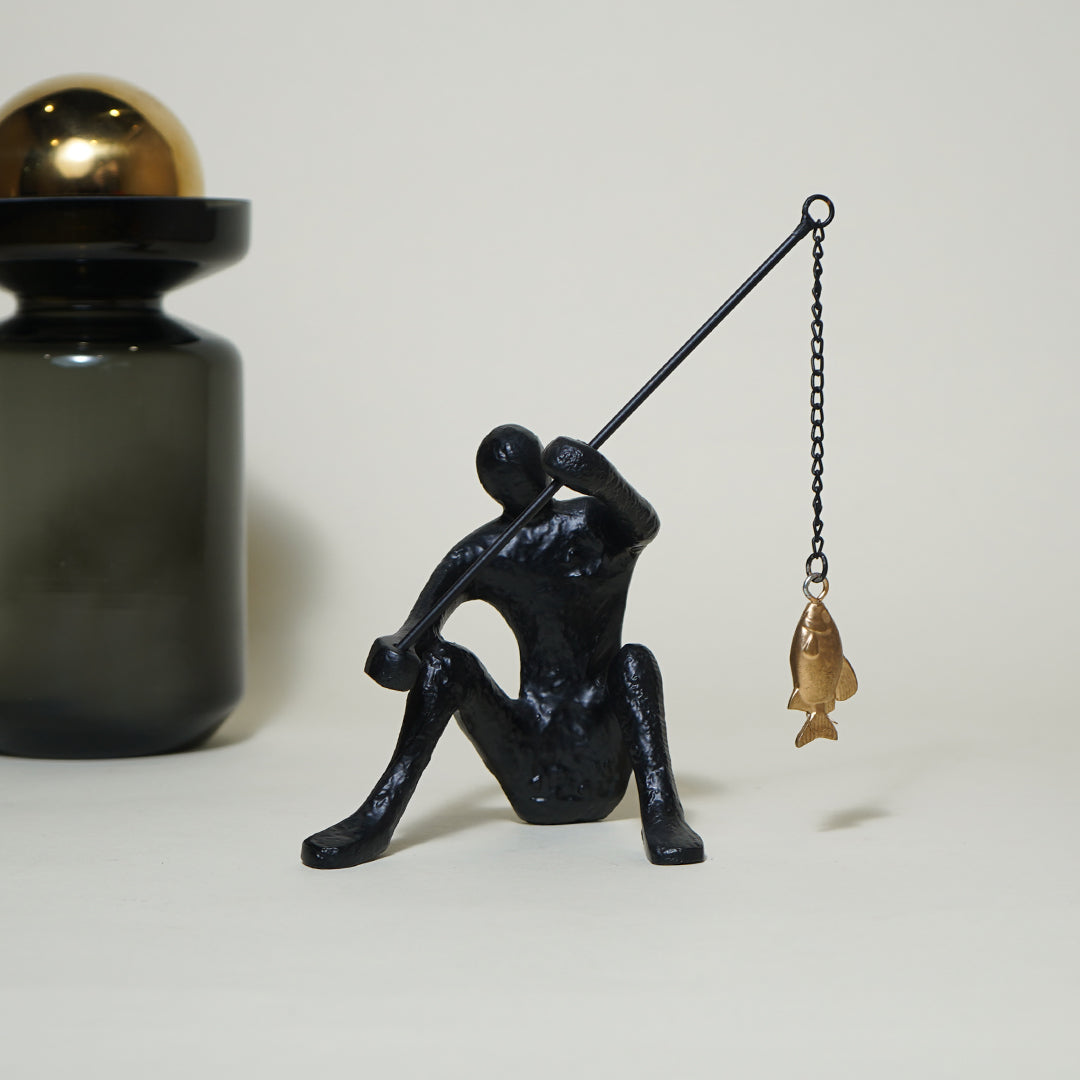 Dux Fishing Man Sculpture
