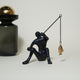 Dux Fishing Man Sculpture