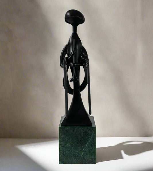 4-foot Japandi Clarinet Man Sculpture with marble base placed at modern entryway – tall modern luxury home décor.