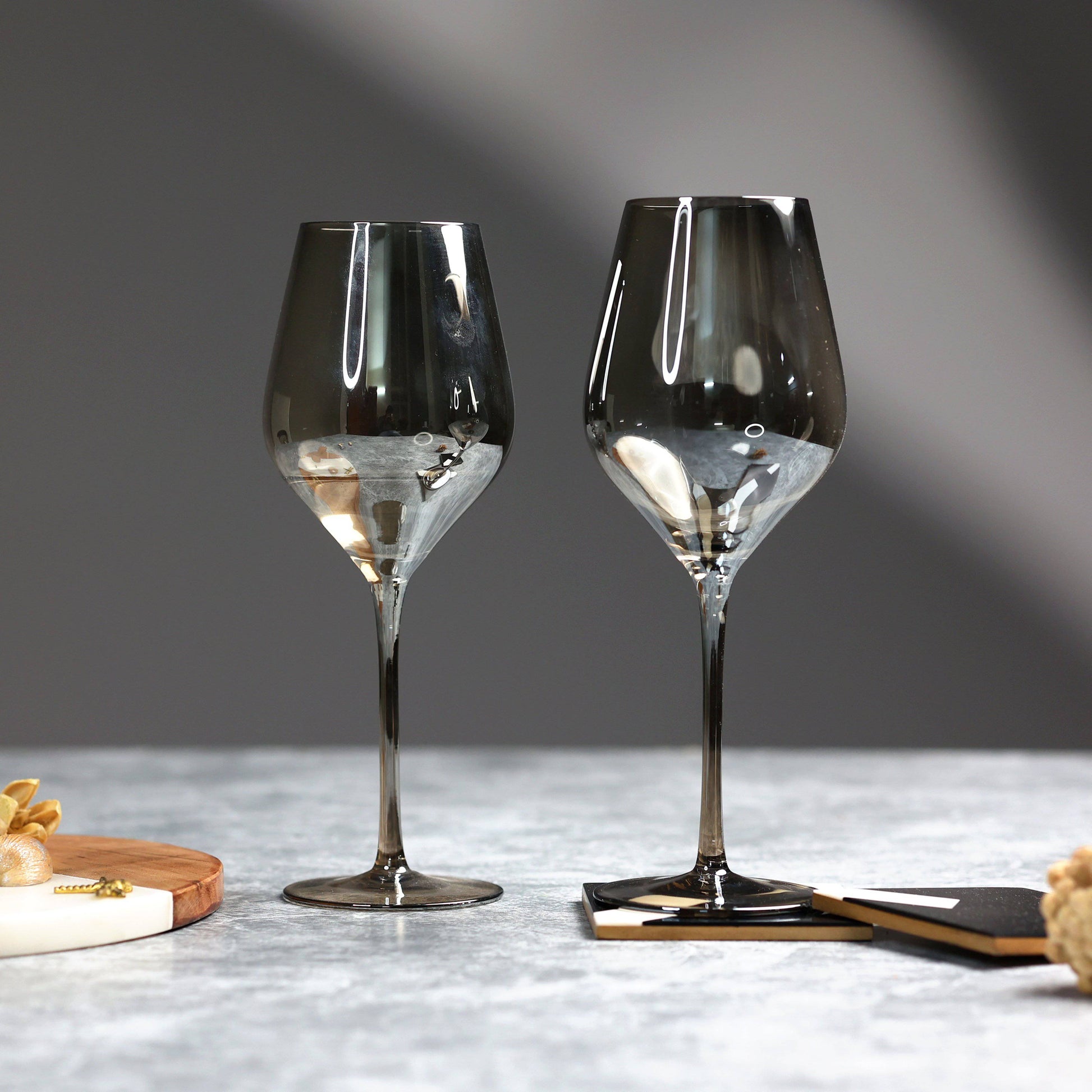https://www.thedecorcircle.com/cdn/shop/products/the-decor-circle-dinnerware-barware-ash-smokey-grande-wine-glasses-set-of-2-set-of-6-28306443763901.jpg?v=1647619569&width=1946